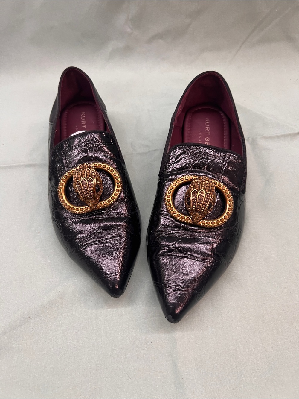 Kurt Geiger Black Pointed Leather Flats with Gold Medallion